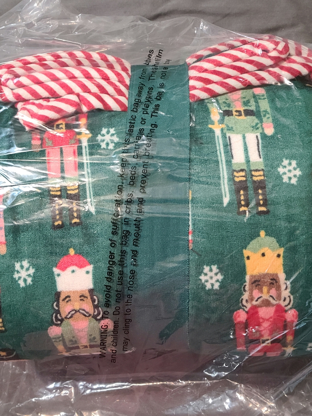 Green Nutcracker Print Holiday Throw Blanket with Candy-Stripe Trim